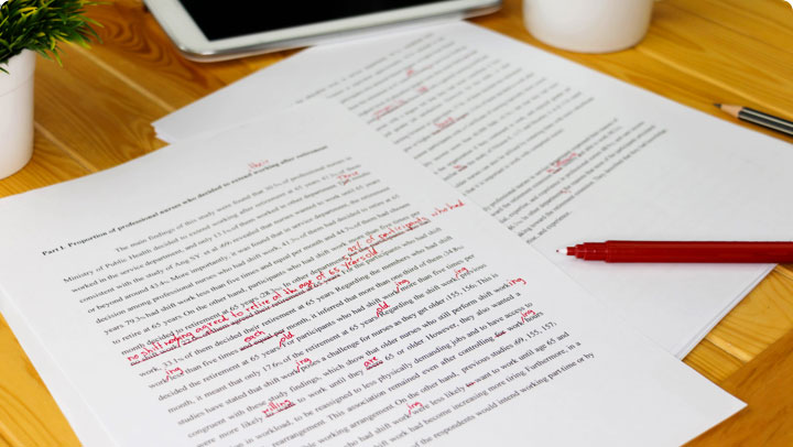 Image of an essay with red markings