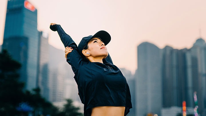 Image of a woman stretching before a run