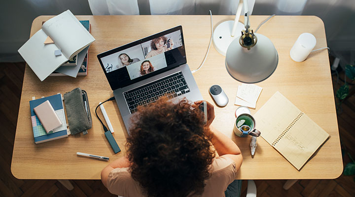 women at a desk working from home. video conference